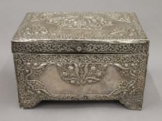 An 18th/19th century Eastern, probably Persian unmarked silver clad casket. 25 cm wide.