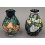 Two small modern Moorcroft vases. Each approximately 13.5 cm high.