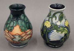 Two small modern Moorcroft vases. Each approximately 13.5 cm high.