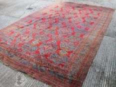 A large red ground rug. 356 cm x 596 cm.