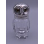 A cut glass pepper mounted as an owl. 7 cm high.