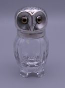 A cut glass pepper mounted as an owl. 7 cm high.