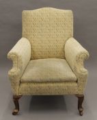 An Edwardian armchair. 77 cm wide.