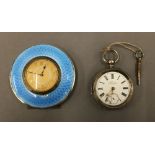 A hallmarked silver and blue enamel travel clock,