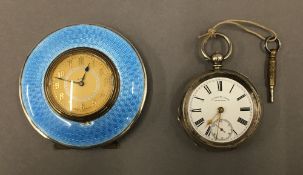 A hallmarked silver and blue enamel travel clock,