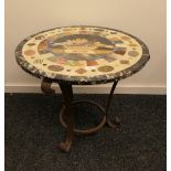 A marble specimen stone inlaid circular table top decorated with Pliny's doves on a wrought iron