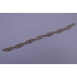 A 9 ct gold bracelet. 17.5 cm long. 7.7 grammes.