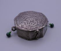 An Afghan white metal box with hinged lid with clasp,