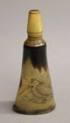 A 19th century horn shot flask, engraved with a snipe. 16 cm high.