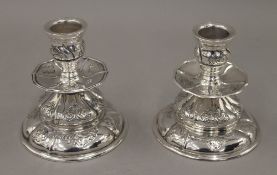 A pair of Danish silver candlesticks, makers mark AD. 9 cm high. 9.6 troy ounces.