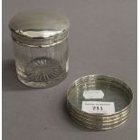 A cut glass and silver topped circular jar,
