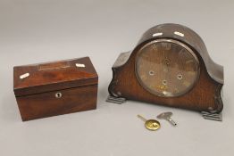 A Victorian rosewood tea caddy and an oak mantle clock. The former 23 cm wide.