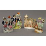 Three 19th century Staffordshire figures and a cottage. The latter 17 cm high.