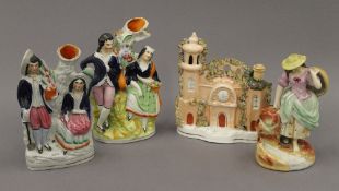 Three 19th century Staffordshire figures and a cottage. The latter 17 cm high.