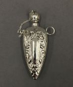 A silver pendant scent bottle. 6 cm high.