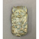 A brass vesta formed as a cat. 7 cm high.