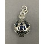 A silver Masonic lapis ball pendant. 2.5 cm high.