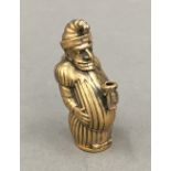 A brass vesta formed as Mr Punch. 5 cm high.