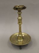 A Persian brass oil lamp. 30 cm high.