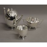 A three piece silver plated Deco tea set