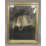 A vintage photograph of a young lady by Bertram Park, signed beneath, framed and glazed.