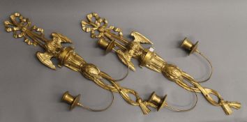 A pair of carved giltwood twin-branch wall lights. 74 cm high.