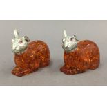 Two models of rabbits. 6 cm long.