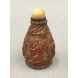 A 19th century carved coquilla nut snuff bottle. 7.5 cm high.