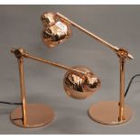 A pair of copper anglepoise lamps