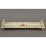 A 19th century carved ivory cribbage board. 27.5 cm long.