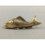 A brass vesta formed as a fish. 7.5 cm long.