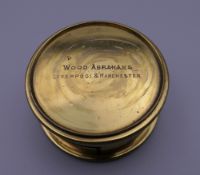 A Wood Abrahams brass lens. 5 cm diameter.