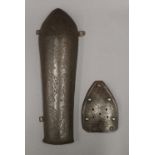 An engraved Qajar steel armlet, traces of gilding and a smaller steel section of armour.