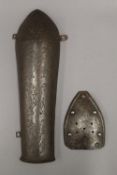 An engraved Qajar steel armlet, traces of gilding and a smaller steel section of armour.