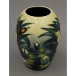 A small modern Moorcroft bulbous vase. 13 cm high.