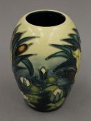 A small modern Moorcroft bulbous vase. 13 cm high.