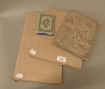 Three vintage postcard albums