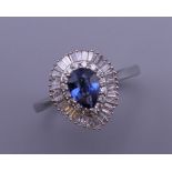 A platinum pear shaped Ceylon sapphire and diamond ring. Ring size Q. 5.7 grammes total weight.