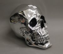 A silvered skull. 19 cm high.