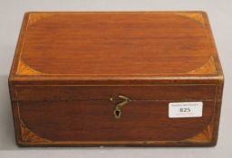 A 19th century inlaid mahogany box, containing various medical bottles, etc. 24 cm wide.