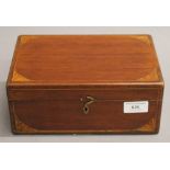 A 19th century inlaid mahogany box, containing various medical bottles, etc. 24 cm wide.