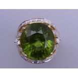 An 18 ct gold tourmaline and multi diamond ring. Ring size O. 15.8 grammes total weight.