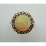 An 18 ct gold diamond and cabochon opal ring. Ring size O/P.