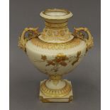 A Royal Worcester vase. 21 cm high.