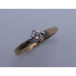 A 9 ct gold diamond solitaire ring. Ring size M/N. 1.9 grammes total weight.