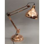 A copper anglepoise lamp.