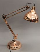 A copper anglepoise lamp.