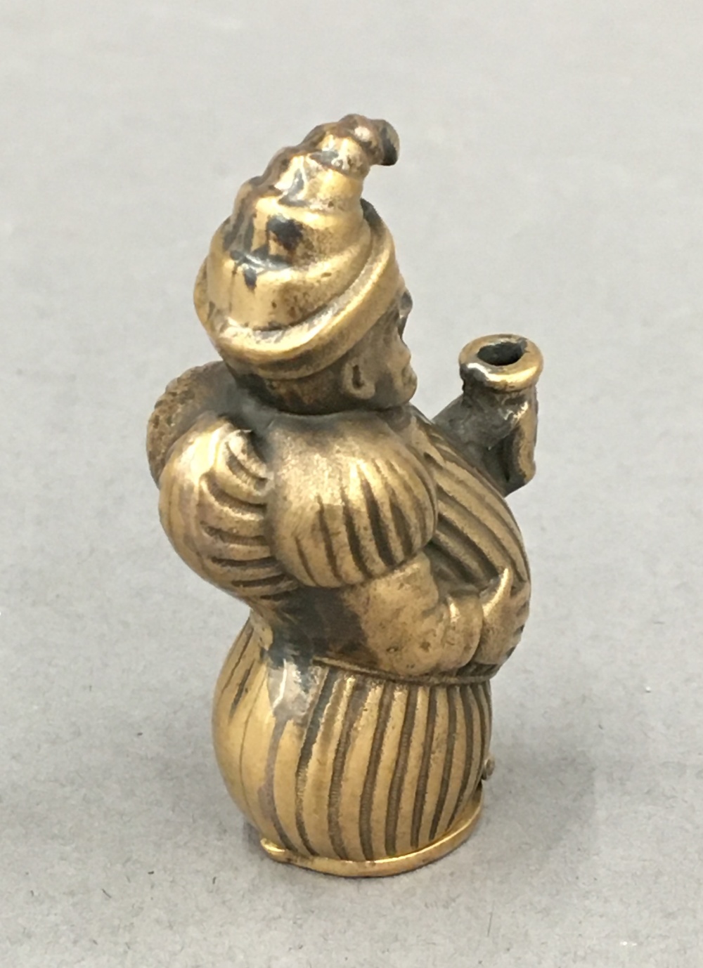 A brass vesta formed as Mr Punch. 5 cm high. - Image 3 of 3