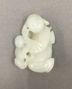 A white jade figural carving. 5.5 cm high.