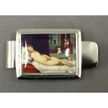 A sterling silver money clip decorated with a nude lady. 5 cm long.